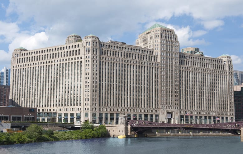 Very large white building on a river